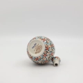 Hand-painted round decanter made from traditional Bolesławiec pottery. Unique ceramic bottle perfect for serving liqueurs, water, or as a table decoration.
