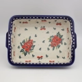 Bake and serve delicious home-cooked meals with this authentic Bolesławiec ceramic baking dish with side handles.