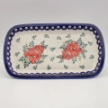 Handmade Bolesławiec ceramic serving platter featuring traditional Polish pottery stamp designs.