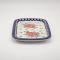 Handmade Bolesławiec ceramic serving platter featuring traditional Polish pottery stamp designs.