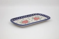 Handmade Bolesławiec ceramic serving platter featuring traditional Polish pottery stamp designs.