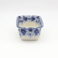 Hand-painted Bolesławiec stoneware baking pan with iconic blue and white folk art design.