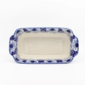 Artisan-made Bolesławiec stoneware baking dish with comfortable handles for easy carrying.