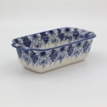 Handmade Bolesławiec ceramic baking dish featuring traditional Polish pottery stamp patterns.
