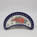 Handmade Bolesławiec ceramic crescent tray featuring traditional Polish pottery stamp patterns.