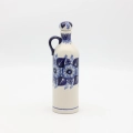 Handcrafted Bolesławiec ceramic bottle.