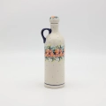 Handcrafted Bolesławiec ceramic bottle.
