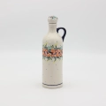 Handcrafted Bolesławiec ceramic bottle.