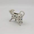 Traditional Bolesławiec stoneware creamer with an ergonomic handle and pour spout.