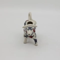 Traditional Bolesławiec stoneware creamer with an ergonomic handle and pour spout.