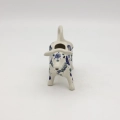 Traditional Bolesławiec stoneware creamer with an ergonomic handle and pour spout.