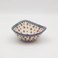 Handcrafted Bolesławiec ceramic bowl with traditional hand-painted pattern.