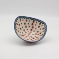 Handcrafted Bolesławiec ceramic bowl with traditional hand-painted pattern.