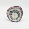 Handcrafted Bolesławiec ceramic bowl with traditional hand-painted pattern.