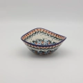 Handcrafted Bolesławiec ceramic bowl with traditional hand-painted pattern.