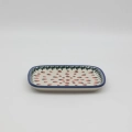 Handcrafted rectangular Bolesławiec ceramic platter with traditional hand-painted pattern.