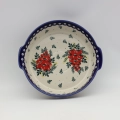 Round ceramic serving dish with handles, perfect for baked meals, snacks, and appetizers.