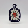 Small ceramic cheese board with convenient handle for serving snacks and appetizers.