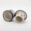 Hand-decorated ceramic water butter crock combining traditional utility with table elegance.