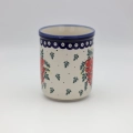 Large ceramic kitchen utensil holder featuring a vibrant hand-painted pattern.