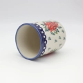 Large ceramic kitchen utensil holder featuring a vibrant hand-painted pattern.