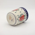 Large ceramic kitchen utensil holder featuring a vibrant hand-painted pattern.