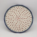 Decorative stoneware cake server showcasing classic Polish pottery craftsmanship.