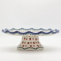 Decorative stoneware cake server showcasing classic Polish pottery craftsmanship.