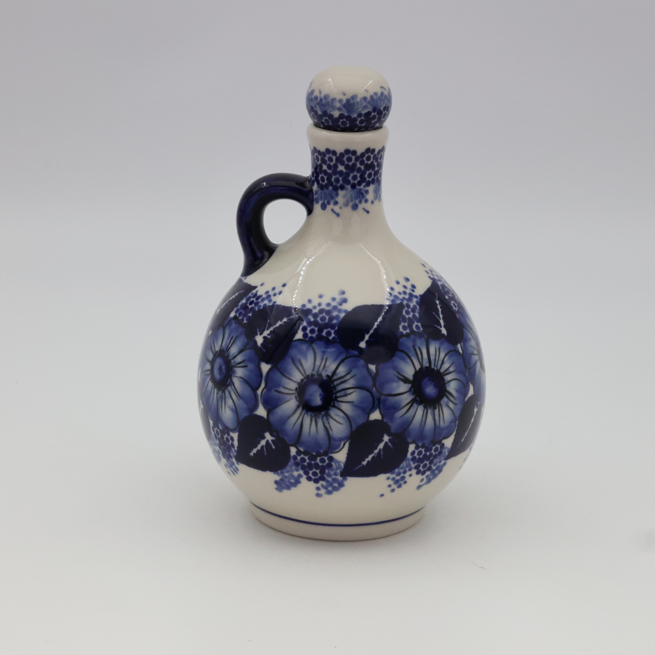 Round bottle carafe from Bolesławiec pottery – an elegant and functional vessel for serving drinks, wine, or water.