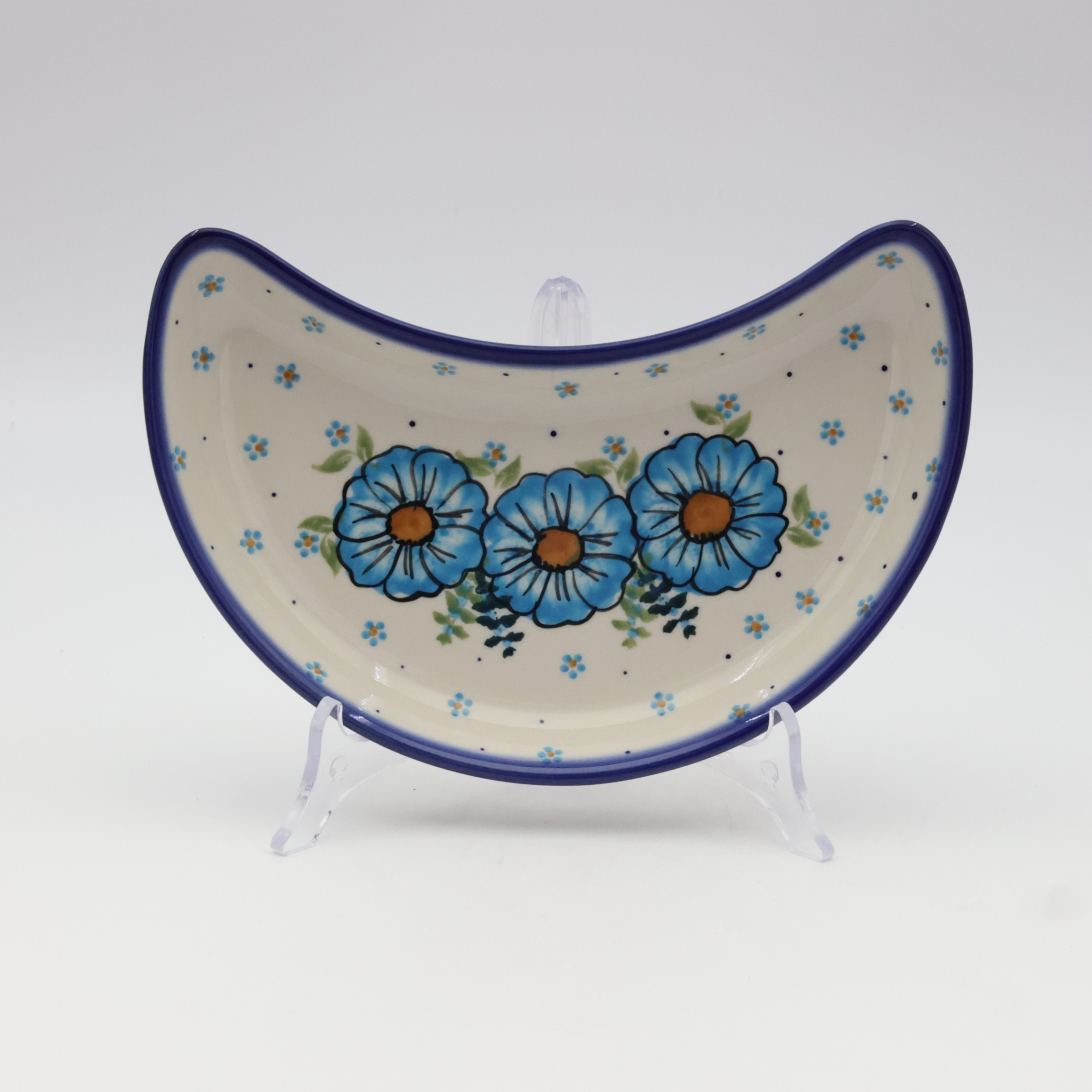 Unique Bolesławiec tray in crescent shape, perfect for serving snacks.