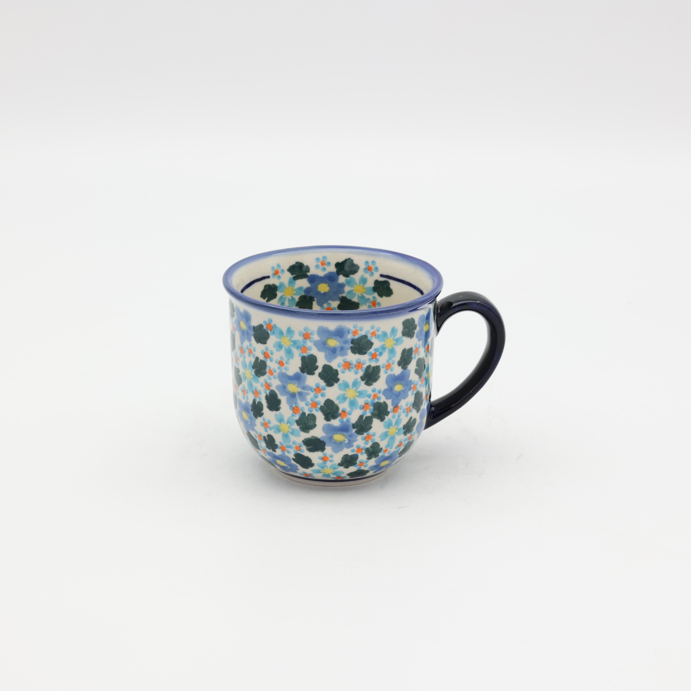 Hand-painted cup made from traditional Bolesławiec pottery. Elegant and functional, perfect for serving coffee and tea for everyday use or special occasions.