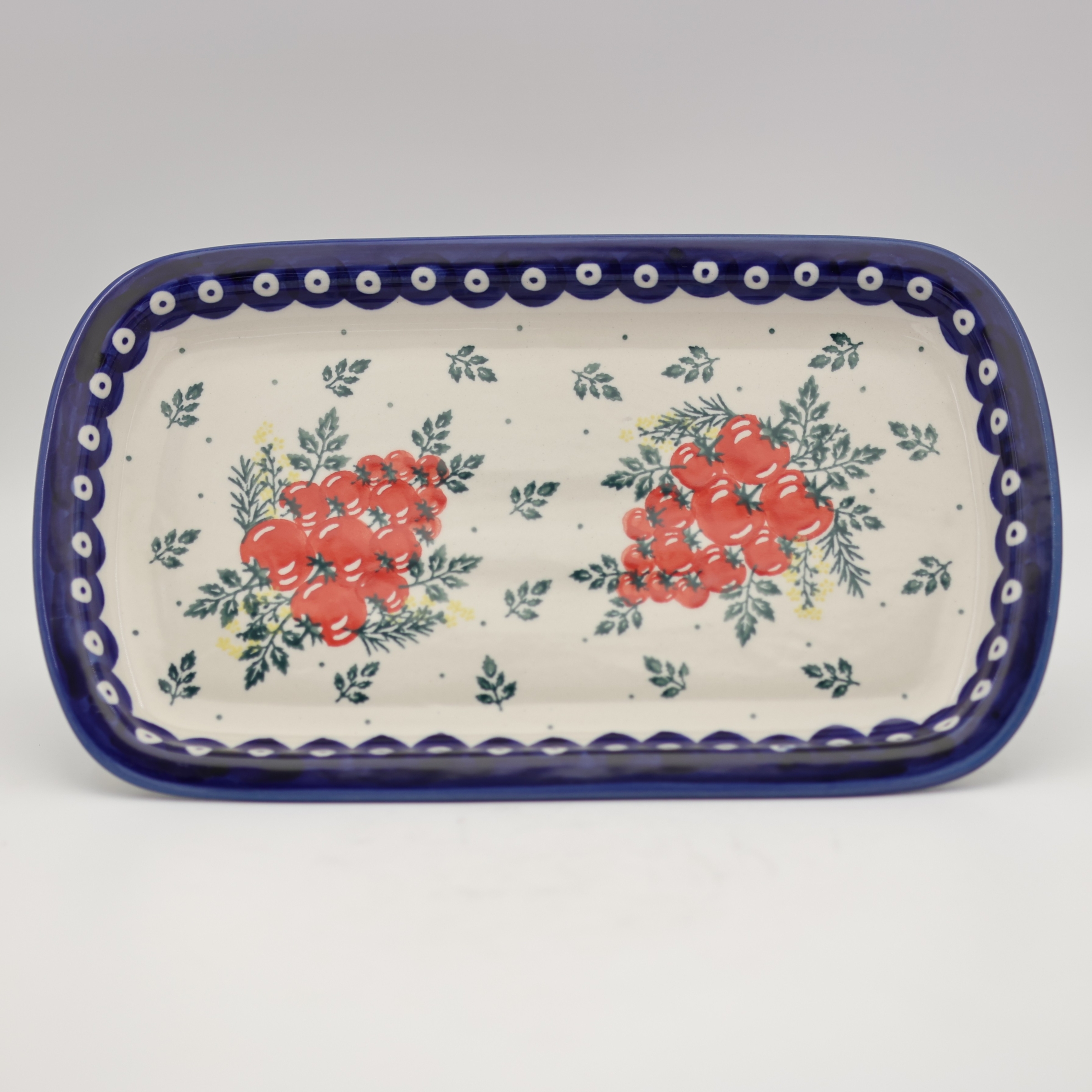 Handmade Bolesławiec ceramic serving platter featuring traditional Polish pottery stamp designs.