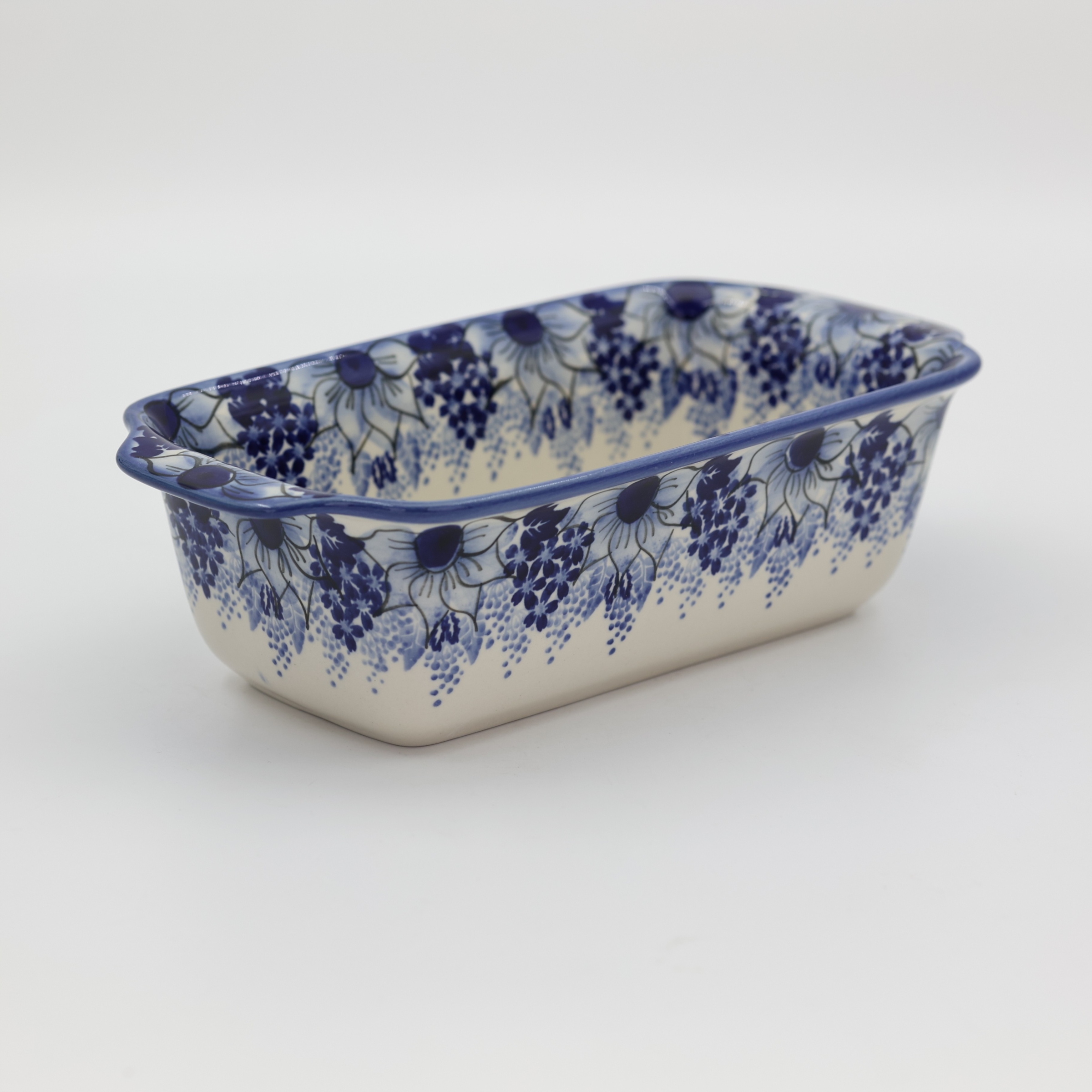 Handmade Bolesławiec ceramic baking dish featuring traditional Polish pottery stamp patterns.