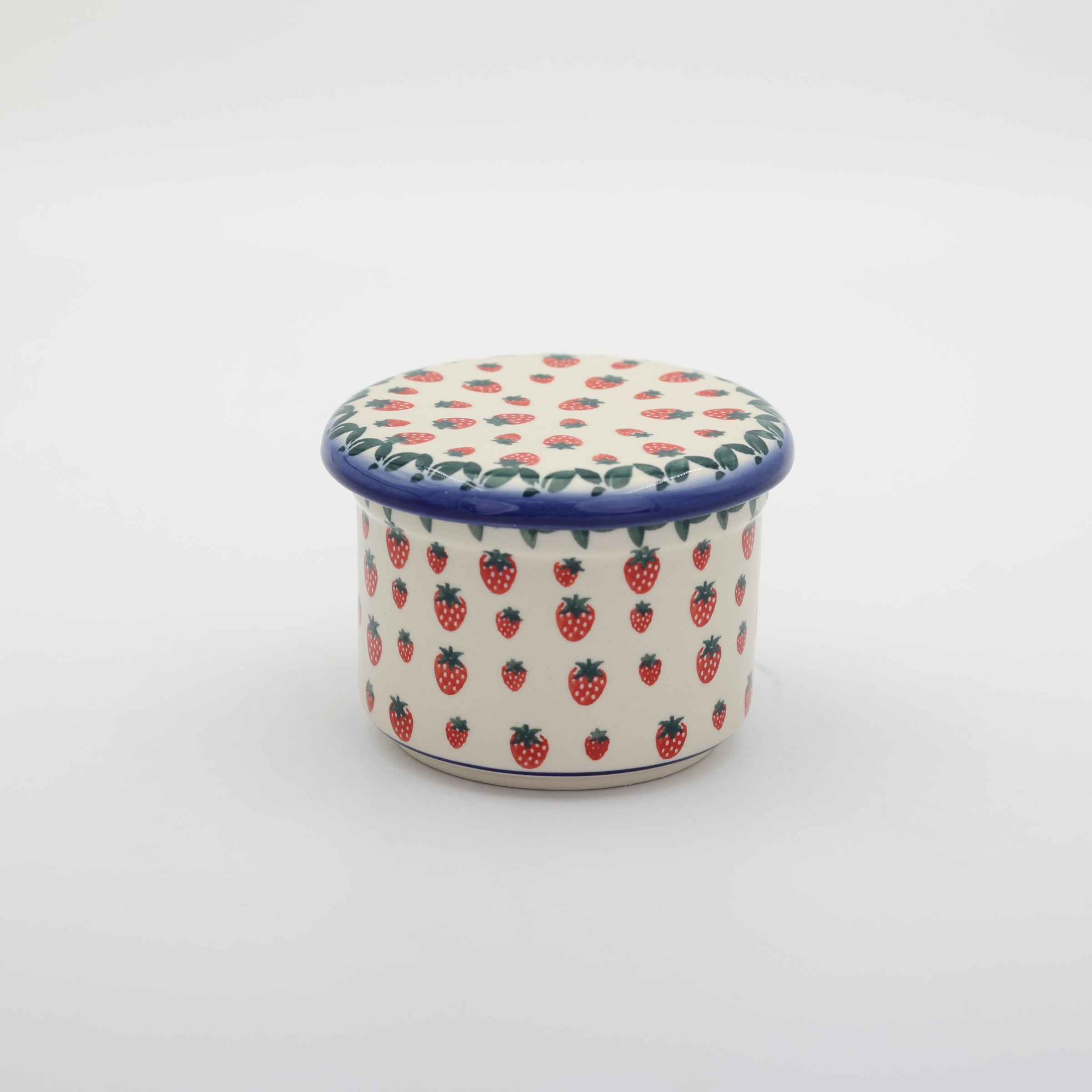 Handmade Bolesławiec ceramic French butter keeper featuring traditional Polish pottery stamp patterns.