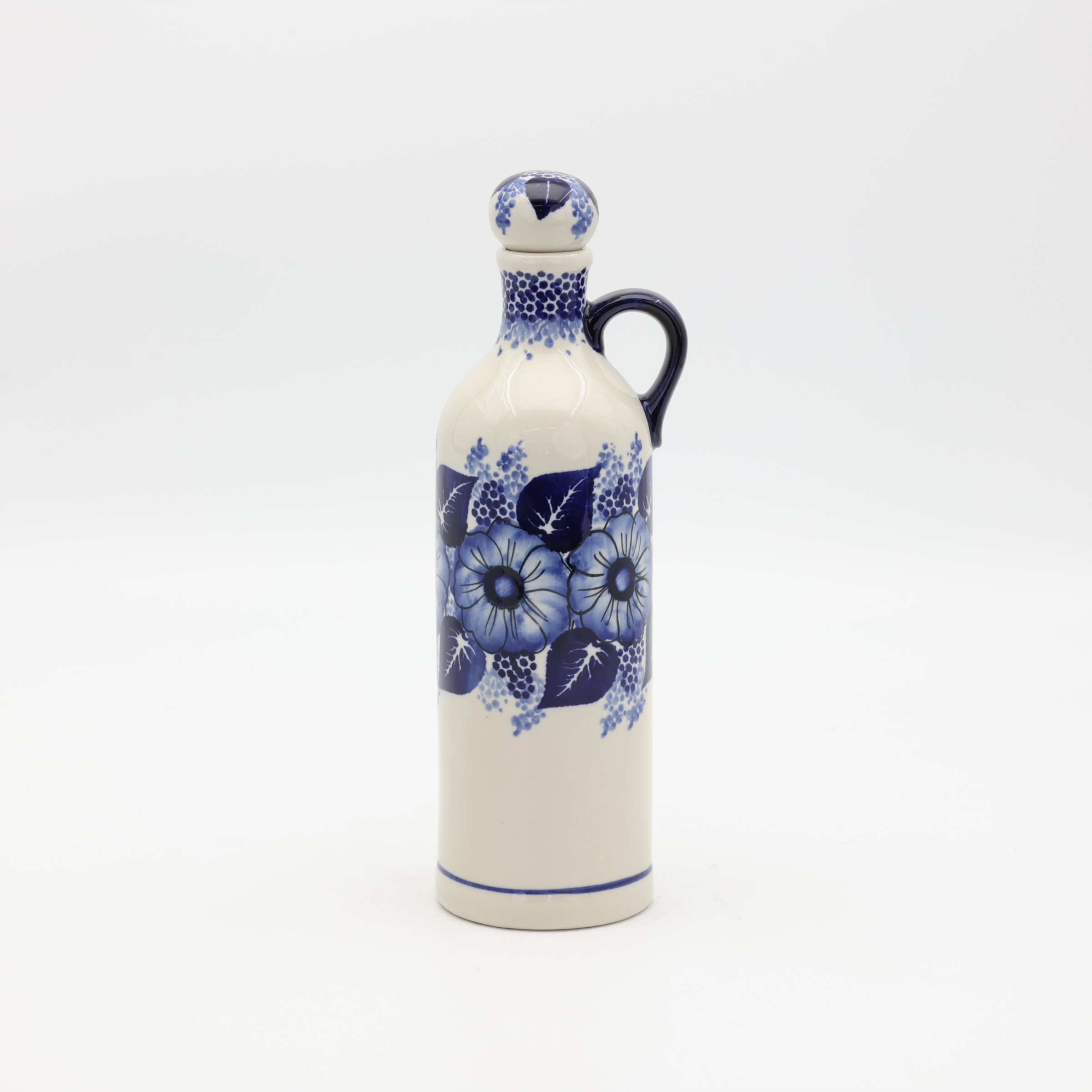 Handcrafted Bolesławiec ceramic bottle.