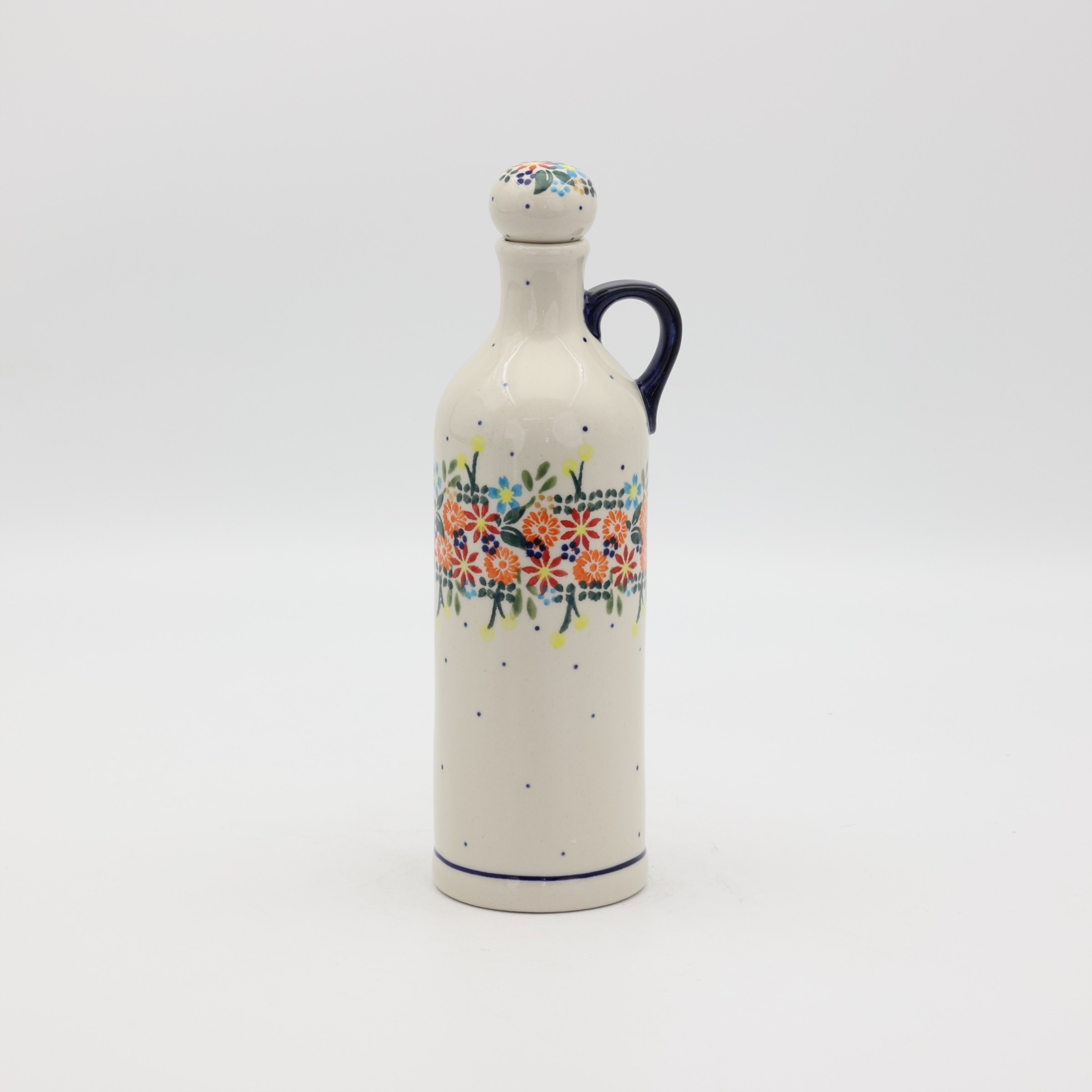 Handcrafted Bolesławiec ceramic bottle.