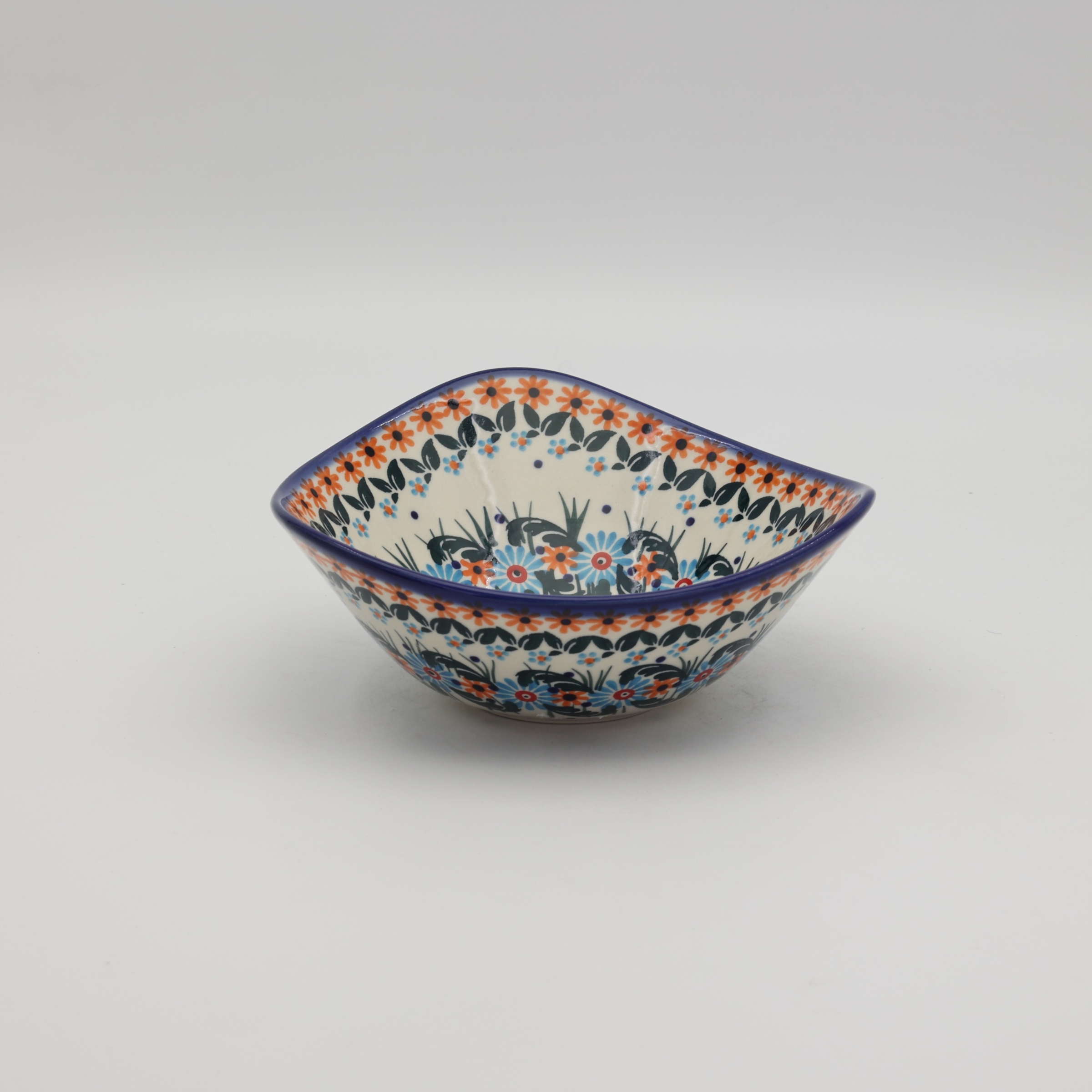 Handcrafted Bolesławiec ceramic bowl with traditional hand-painted pattern.