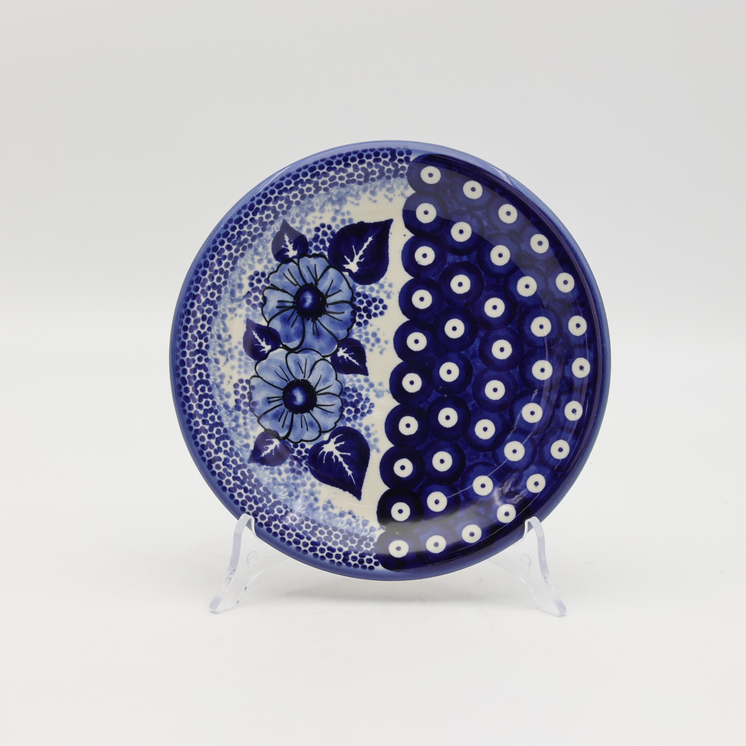 Handcrafted Bolesławiec ceramic dessert plate with traditional hand-painted pattern.